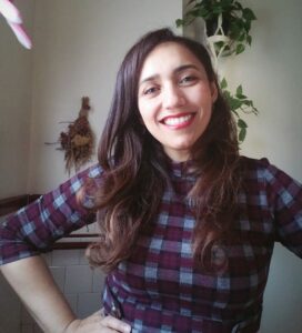 JC Straub selfie on Thanksgiving Day, Smiling, wearing a plaid dress.